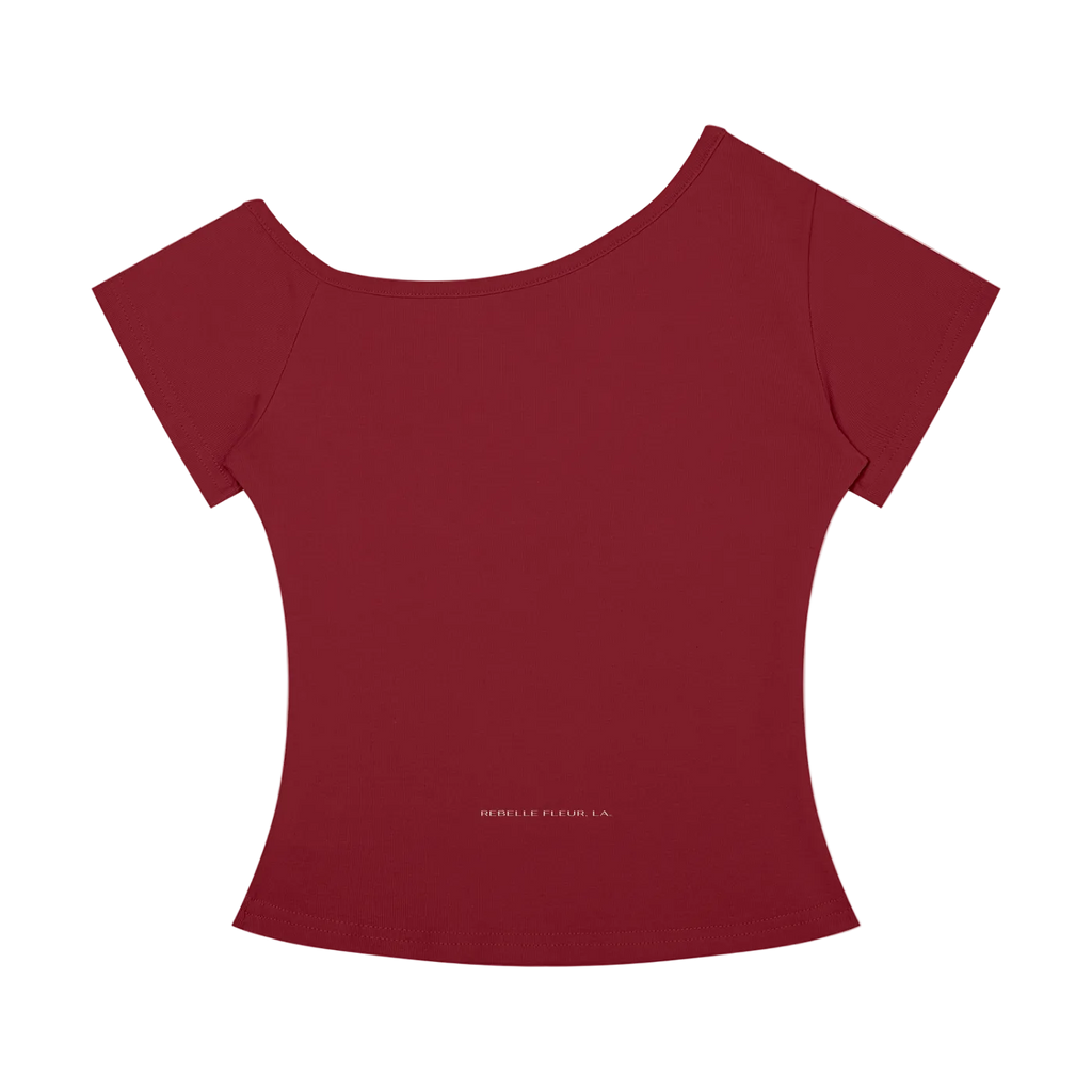 Wine-red off-the-shoulder women's t-shirt with short sleeves, fitted waist and small 'REBELLE FLEUR. LA.' logo near hem.