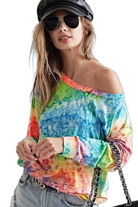 Off-shoulder multicolor tie-dye long-sleeve top on model, paired with jeans and a chain-strap bag