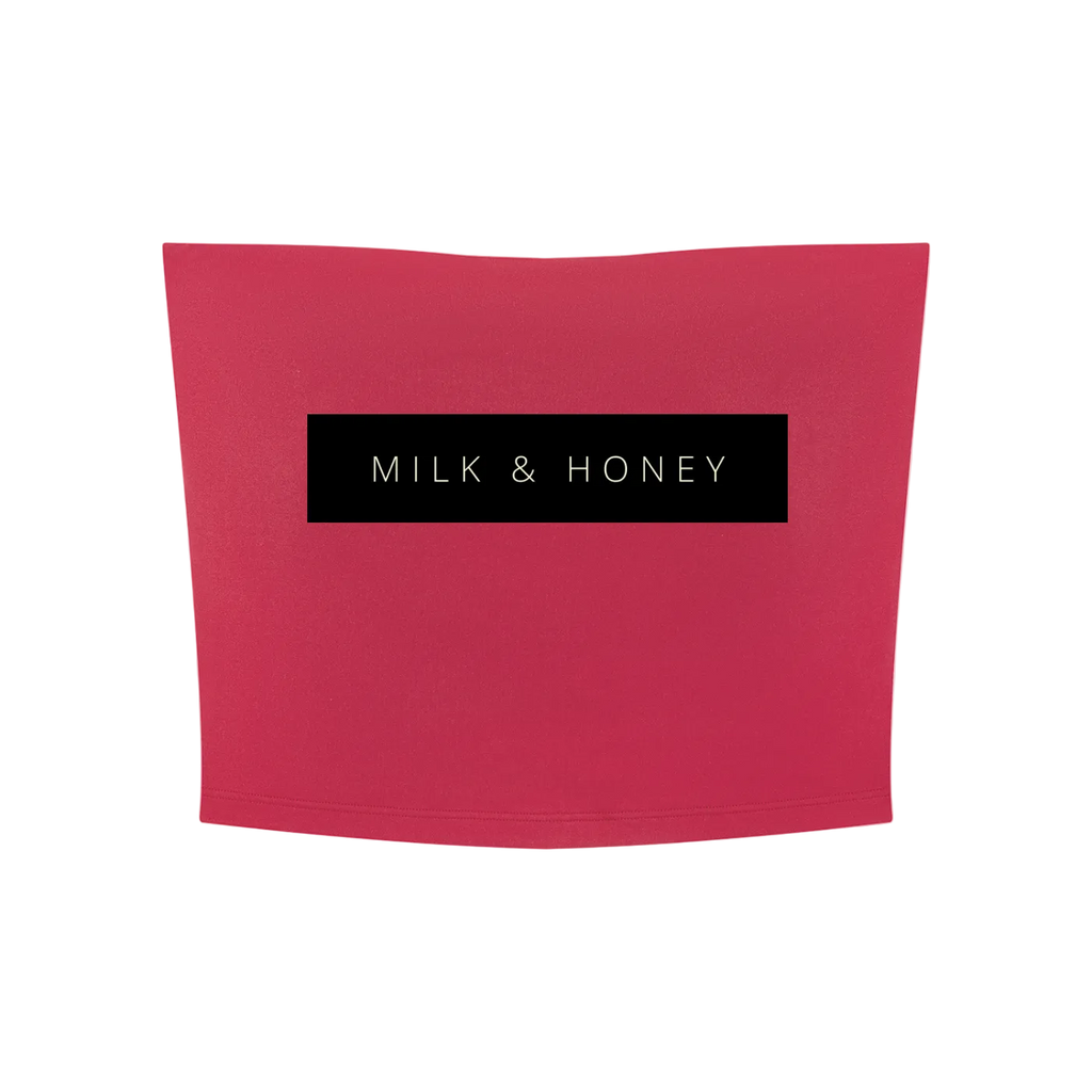 Rose red cropped tube top with centered black rectangle reading 'MILK & HONEY'