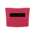Rose red cropped tube top with centered black rectangle reading 'MILK & HONEY'