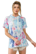 Model wearing aqua blue tie-dye short-sleeve terry hoodie with cream drawstrings and frayed light shorts