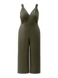 Olive jumpsuit with smocked shoulder straps, crossover V-neck, fitted waist seam and wide legs