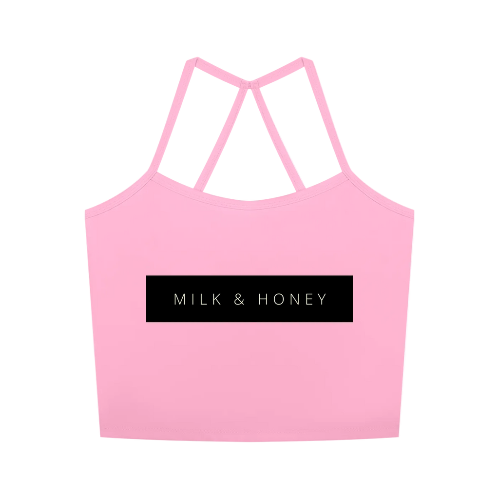 Pink cropped tank top with double crisscross back straps and centered black "MILK & HONEY" logo