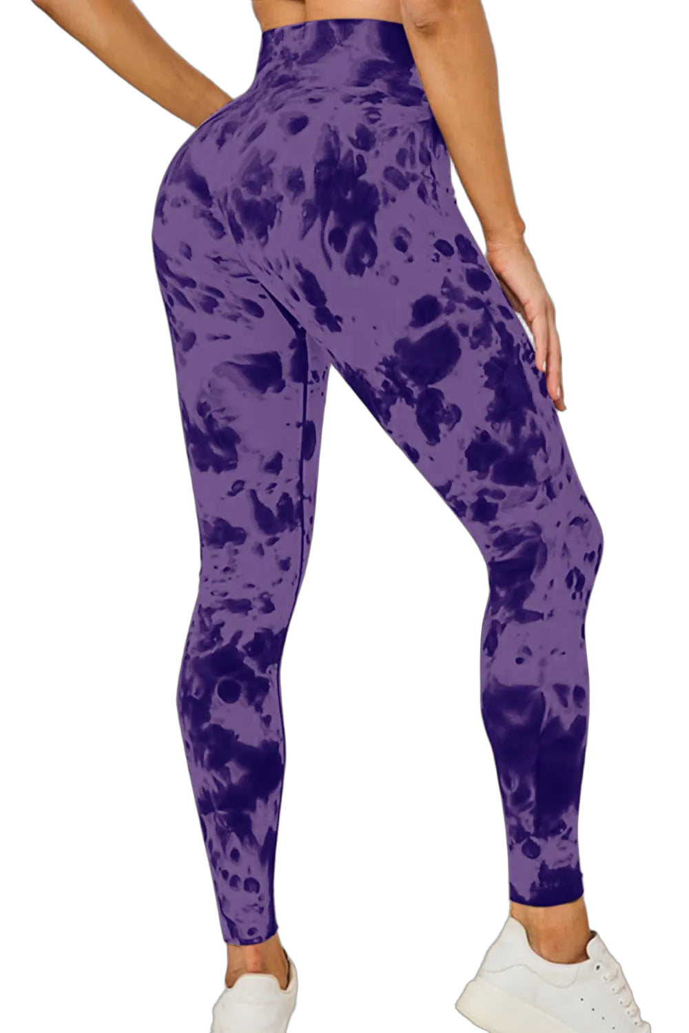 Back view of high‑waist tie‑dye leggings in purple with darker blotches, paired with white sneakers